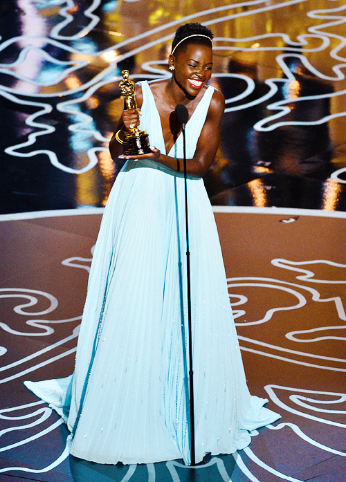  Lupita Nyong’o accepts the Best Performance by an Actress in a Supporting Role award onstage during the Oscars at the Dolby Theatre - March 2, 2014 
