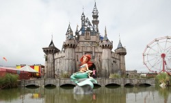 culturenlifestyle:  Inside Banksy’s Alternative and Grim Version of Disneyland Welcome to Dismaland, where life isn’t always a fairy tale! Located at the seaside resort of Weston super Mare in the UK, Dismaland is a sinister, dystopian and less glamorous