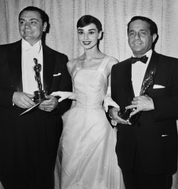 foreverlovingaudrey:  Audrey Hepburn at the 28th Academy Awards with two “Marty” Oscar winners: Ernest Borgnine (Best Actor) and producer Harold Hecht (Best Picture)