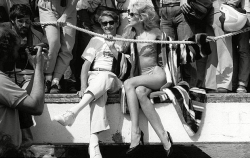 candypriceless:  Helmut Newton with Jerry Hall at the Cannes film festival, 1983 - photo by David Bailey 