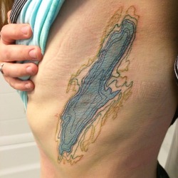 fuckyeahtattoos:  Topography map of Dream Lake, AKA Fairfield Pond, in Vermont.  Done by Adam Desjardin at Body Art Tattoo in Burlington VT. Photo taken about two hours after tattoo was completely 