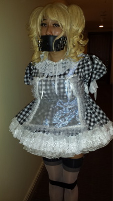 sissybimbodolly: What happened…? I woke up, suddenly fully clad in the most humiliating prissy sissy gingham dress ever, with thick masses of petticoats putting my matching panties on display. I was blonded, corseted, bound with an armbinder and tape,