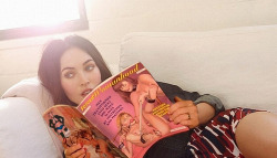 Megan Fox reading up on sissy training in the latest issue of Forced Womanhood magazine.