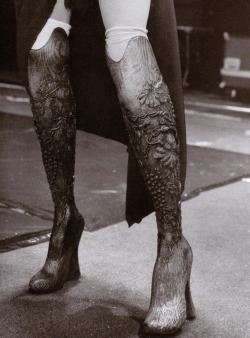 lavandula:  alexander mcqueen spring/summer 1999, prosthetic legs legs carved out of solid wood 
