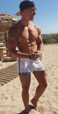 wrestlingsubmission:  itsswimfever:Blond beach muscle… Cocky dude showing off is just asking to be tackled and beat in a submission wrestling match on the beach!(Anyone know who this guy is? Please message me if so)