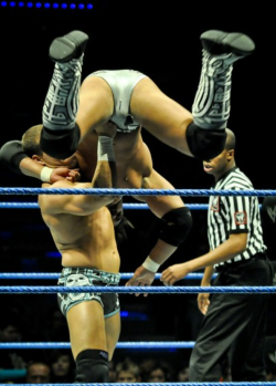 rwfan11:  Justin Gabriel …. It appears that his trunks are torn at the crotch, where his sac is, unless that’s just the design, but you can see a slight tear/run at the ‘taint’ area too! LOL! They need to book him more so this poor dude can buy