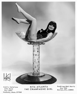  Rita Atlanta      aka. “Miss International”.. Late-period promo photo, featuring her signature Champagne Bath glass..  