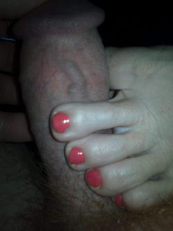 Wifes feet stroking my cock