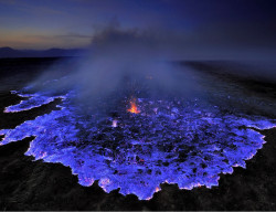 sixpenceee:  Neon blue lava pours from Indonesia’s Kawah Ijen Volcano. The reason it’s blue is because the mountain contains large amounts of pure sulfur, which emits an icy violet colors as it turns. It turns the rocky slopes into a hot, toxic