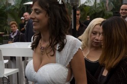 Looks like the 2 women behind her would love to fondle and caress her huge tits.