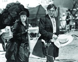 serafino-finasero: Irene Dunne and Richard Dix in a still from the Western film Cimarron (USA, 1931, dir. Wesley Ruggles) | RKO Radio Pictures  At the 4th Academy Awards (1931), Cimarron was nominated for seven Oscars and won three: Best Picture, Best