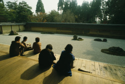 unrar:    Visitors meditate at the Ryonaji Zen garden in Kyoto, Japan, Martin Gray.
