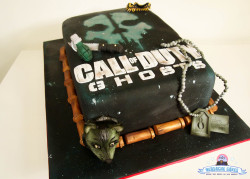 nerdachecakes:  A super cool Call of Duty: Ghosts cake I did last week for a rough-and-tough 8 year old.  Grenades? Check. Bullet Belt? Check. Dog tags? Check! Lots of faux weathering and airbrushing? Check check check! Facebook / Twitter / YouTube