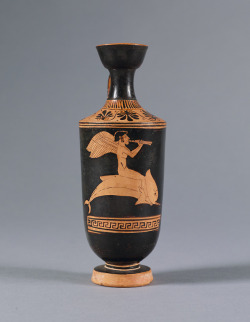 fishstickmonkey: Red-figure Lekythos: Eros Riding a Dolphin and Playing the Double Flutes (Auloi) attributed to the Bowdoin Painter Greek, Attic, ca. 480 B.C. Ceramic Princeton University Art Museum  I didn’t know dolphins used to look like dicks!