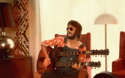 older-soul:Eric Clapton with double neck guitar, 1974 Photo by Pattie Boyd