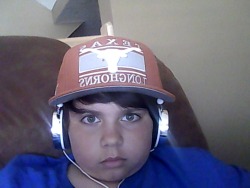 My little brother got a new hat and wanted to show Tumblr what he look like with it on and with the headsets on too.