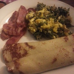 Scrambled eggs with cheddar cheese and leafy greens, bacon and homemade crepes stuffed with cream cheese and honey. So gooood.