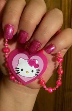 I painted my nails all pretty. Posing with my light up Hello Kitty necklace.