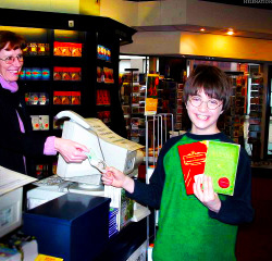 helenation:  A young Daniel Radcliffe with the books Fantastic Beasts and Where to Find Them and Quidditch through the Ages 