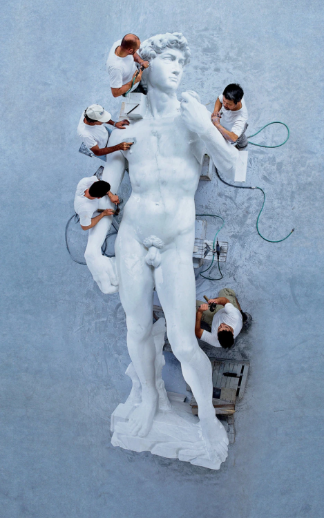desimonewayland:  A crew working on a reproduction of Michelangelo’s David in Carrara, Italy.Photo illustration by Maurizio Cattelan for The New York Times.