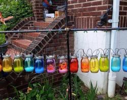 fandomsandfeminism:  atopfourthwall:  scottlynch78:  matociquala:  A Maryland woman, a widowed mother of four, received the note above concerning her display of rainbow solar jars in her own yard. (Story at the Portland Edge, here.)That’s the relentless