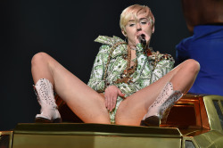 pornwhoresandcelebsluts:  Miley Cyrus spread eagle.. fingering herself and showing off her crotch to her adoring teenage fans live in concert.I never get tired of Miley, I want to be there!