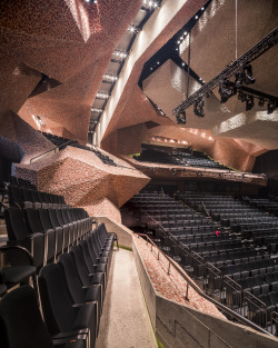 dezeen:  This concert hall in Poland features faceted surfaces of crushed brick and concrete » 