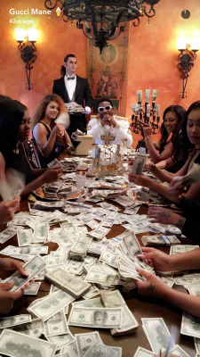 veebiggaveli:Rare photo of Gucci Mane &amp; a bunch of ladies with a table of money. Reblog for 5 years for good luck!