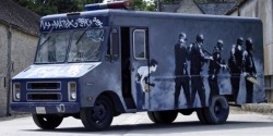 carsthatnevermadeitetc:  GMC SWAT van, 1985 (2006), by Banksy. An artwork by the British artist is to be auctioned by Bonhams tomorrow with an estimate of 跂-430,000. The van depicts a little boy about to prank a SWAT team on one side, and Dorothy from