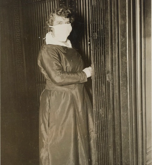 the1920sinpictures:  1918 New York City hotel elevator operator, during the Spanish Flu. From New York City - Vintage History, FB.