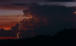 nicleister:  A rotating thunderstorm lights up the Sonoran Dusk.  As seen from Mt. Ord nearly 80 miles to the east.   
