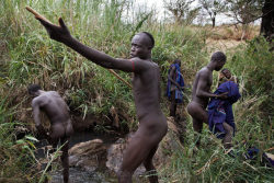   Ethiopia’s Omo Valley, by Olson and Farlow    Bugu (center) has a dispute over a woman and challenges his rival to a Donga (stick fight). Bugu gathers his friends from his village and they start an elaborate age-old ritual that ends in injury for