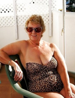 Another shot of this sexy beach babe in her one piece bathing suit. Bet she will get more than the once-over by all the horny young studs at the beach.Check out my other granny blog here!