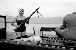 Frank Horvat - Girl with machine-gun, Eilath, Israel, 1954.