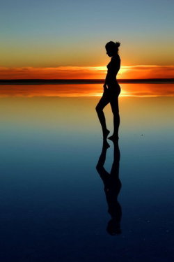 decent-nude-persons:  Nude art: very colorful and artisitic photo at sunset. Human shadow at dusk. We only see forms, light and shadows, but God knows this person inside.