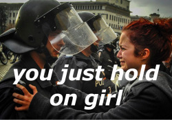 textoverimage:One year ago Text: This girl was crying and begging the policeman not to hit her or any of her friends. Then the policeman started crying as well and he said to her: “You just hold on girl.” Image: photographer by the name of Torod