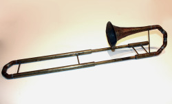 This is a home made slide trumpet, measuring about 2 ft long when contracted. It was meant to be tuned to B flat, but it wound up being tuned to C. I made this in high school as a side project, so the construction is sturdy, but unsightly. That said,