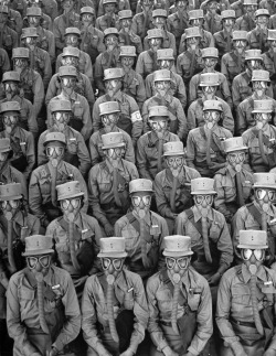 Marie Hansen - Row upon row of WACs (Women&rsquo;s Army Corps members) don gas masks for a training drill at Iowa&rsquo;s Fort Des Moines, 1942.