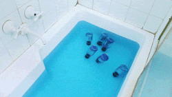 lesprisenpati:  aidenmorse:  Bottles of Gatorade Blue Bolt floating in a bath of Powerade Mountain Blast, 2013   I can’t tell if this is seriously art or if it’s just tongue in cheek sarcastic art or if it’s post-ironic ironic art, or ironic art,