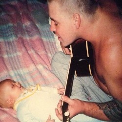 andycud:  creationofrecreation:  Sublime’s lead singer and guitarist Bradley Nowell playing acoustic guitar and singing to his baby son Jakob; only a few months before his eventual drug overdose.  :( 