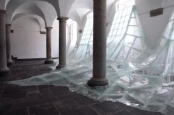 who-:  Aerial is a new site-specific installation by Baptiste Debombourg at an old Benedictine monastery called Brauweiler Abbey near Cologne, Germany. Debombourg used numerous sheets of shattered laminate glass to mimic a frothy flood of water rushing