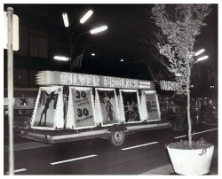 Vintage press photo dated from 1962 features a truck pulling an elaborate trailer ad thru the streets of Chicago, promoting the &lsquo;SILVER FROLICS&rsquo; nightclub; located on 400 N. Wabash Avenue..
