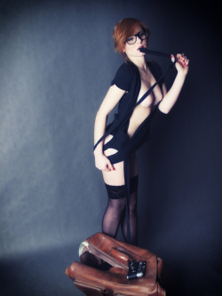 redheadcontrol:  Sexy redhead in glasses and black thigh highs.