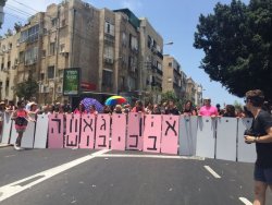 iranian-diaspora: ainsleyhayess:   middleeasternsarecool:  LGBTQ anti-occupation activists block the Tel Aviv Pride Parade with a “separation wall” that says: ‘There’s no pride in occupation.’ x   there’s nothing revolutionary about targeting