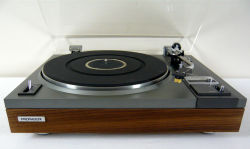 Pioneer PL-115 | Auto Return Belt DriveTurntable. Reconditioned and serviced. Semi automatic. Original vinyl removed and replaced with real wood walnut veneer. Mechanism cleaned and lubricated. The dust cover has been buffed and polished. Sure Hi Track