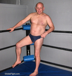 wrestlerswrestlingphotos:  pro wrestler climbing into ring