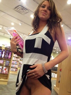 blackcockhoe:  onmyway4455:  peepys-roadrunner:  Dildo shopping at the porn shop and flashing her cunt proving she didn’t wear any panties today!  She’s cute  I love going to the porn shop and looking around, every cock in the place follows me to