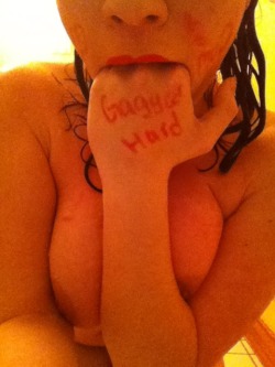 gaggedhard:  Love this submission of a topless cum dumpster shoving her fingers in her mouth and showing “Gagged Hard” written on the back of her hand. Won’t you join my wall of shame? 