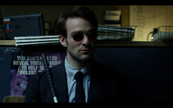 villa-kulla:  Things I am about: this shot of Matt Murdock waiting in the police station, with a poster behind him that says “You don’t have to reveal your identity to help solve violent crimes.”
