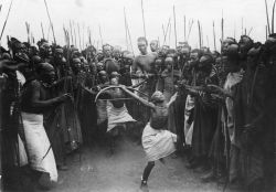 atomickong:Young Tutsi boys dance and reenact “bow-and-arrow combat”, Rwanda 1939.﻿